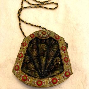 Vintage purse with strap. Great detail!